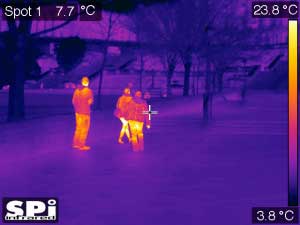 Thermal imaging footage of people walking up a sidewalk in Washington, DC