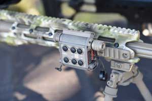 TMSLS tactical laser illuminator mounted on a rifle