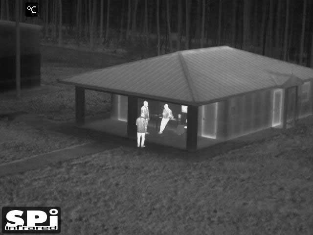 FLIR clip on image of a a group of people by a building