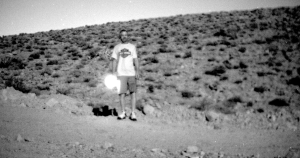 night in desert target with lit cigarette